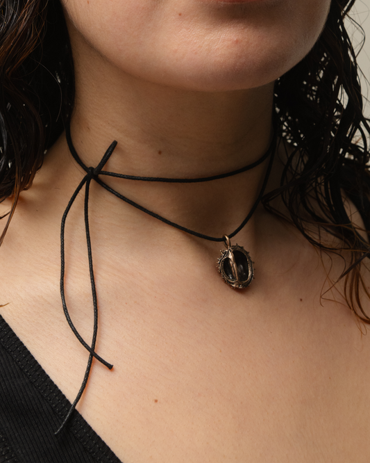 Chestnut pendant, bronze